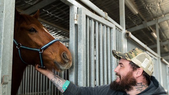 Returned serviceman Clayton Hellyer with retired racehorse Vashka ... “People think we save them. They saved me.”