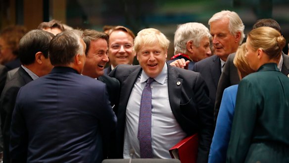Boris Johnson with the EU's chief Brexit negotiator Michel Barnier (right) and Luxembourg's Prime Minister Xavier Bettel (left) during a round-table meeting on Thursday.