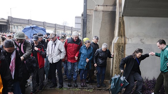 Pro-Palestinian protesters leave after marching across the Sydney Harbour Bridge.