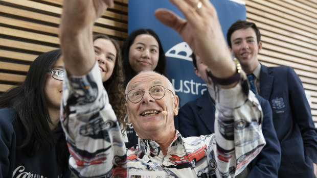 Dr Karl Kruszelnicki takes a selfie with students from Lanyon High School and Marist Collage on Friday.