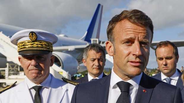 French President Emmanuel Macron speaks after stepping off his plane in New Caledonia on Thursday.