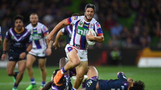 Dynamo: Newcastle fullback Kalyn Ponga breaks into the clear against Melbourne, only to lose the ball in a Billy Slater tackle. 