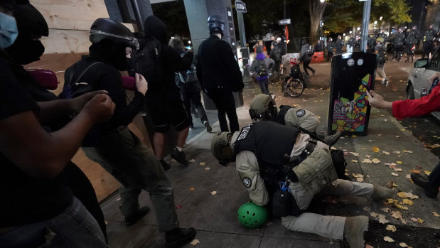 Oregon State Police arrest a protester in Portland on Wednesday.