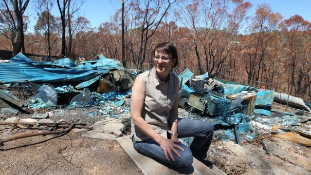 Susan Templeman amid the remains of her razed home after the Blue Mountains bushfire in 2013.
