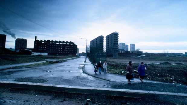 Children walking through housing estate in the Gorbals housing estate, Glasgow.