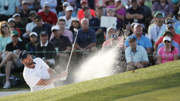 Sand and deliver:  Marc Leishman blasts out of a bunker on the 18th hole during the second round of the Masters.