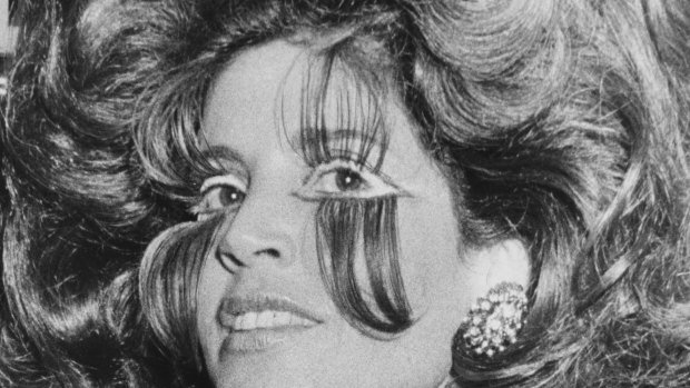 Lillian Frank: As well as her bouffant hair style she was wearing long, long false eye lashes.