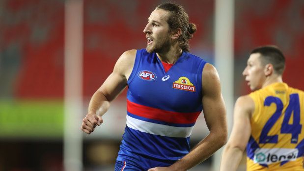 Scent of victory: Marcus Bontempelli keeps the Dogs in the hunt with a goal against the Eagles.