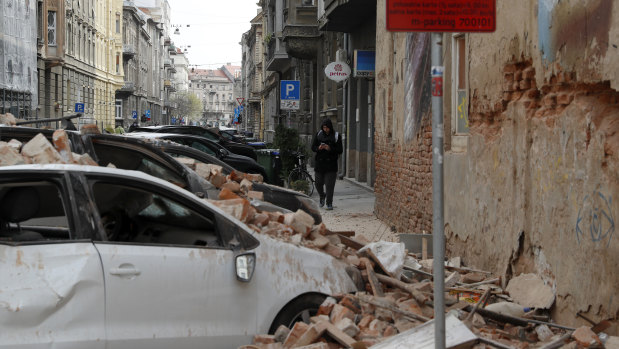Damaged vehicles and fallen debris after the earthquake in Zagreb, Croatia.