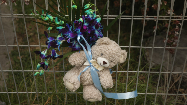 Tributes to the baby boy tied to the fence of the New Lambton home where he was staying before he died.