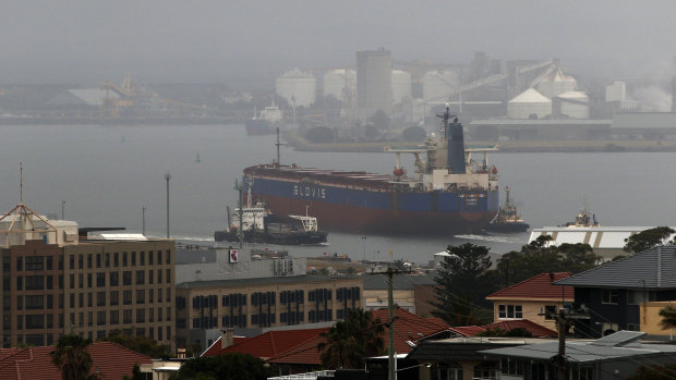 A coal ship enters the Port of Newcastle.