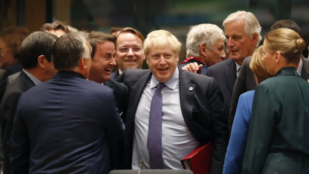 Boris Johnson with the EU's chief Brexit negotiator Michel Barnier (right) and Luxembourg's Prime Minister Xavier Bettel (left) during a round-table meeting on Thursday.