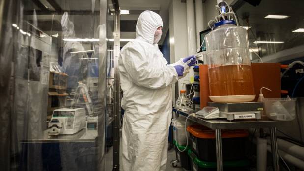 The CSIRO's Professor George Lovrecz at the Clayton manufacturing facility. The vaccine was grown in fermenters, shown right.