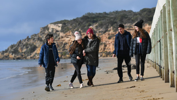 Cold, but the beach was theirs: Sarah Green (centre) camped at Barwon Heads with quadruplets (left to right) Josh, Lara, Will and Mia.  
