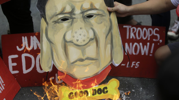 Student activists burn a caricature of Philippine President Rodrigo Duterte during a rally on July 4.