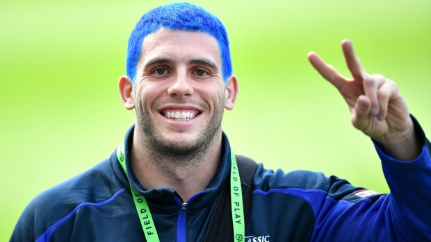 Adam Elliott has dyed his hair blue for a good cause ... Not a bad look.