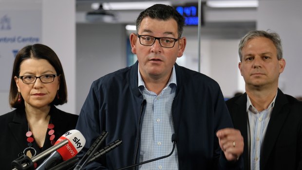 Victorian Premier Daniel Andrews (centre) with Victorian Health Minister Jenny Mikakos and the Chief Health Officer Brett Sutton on Sunday.