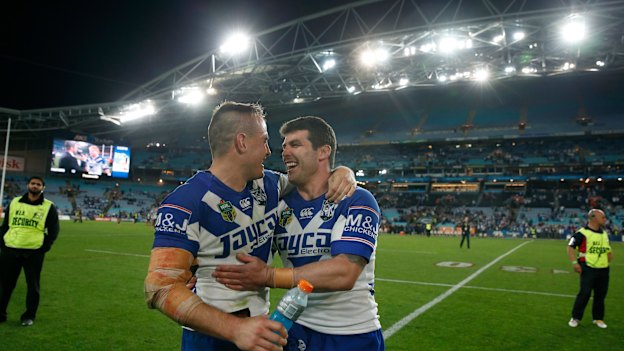 Josh Reynolds hugs Michael Ennis after what turned out to be his last game for the club, missing the 2014 grand final through injury.