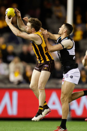 Ryan Burton (right) playing against his old side Hawthorn.