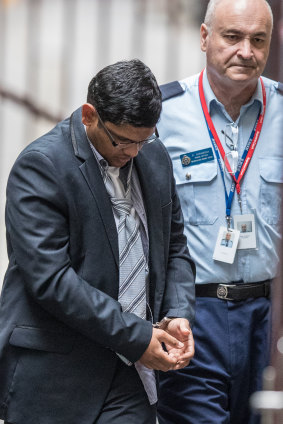 Arun Kamalasanan being led into court in February. 
