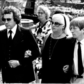 Diana Dors and husband Alan Lake (left) at the funeral.