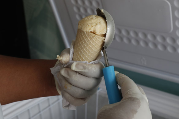 Maria del Carmen Pilapana sells guinea pig ice-cream cones.