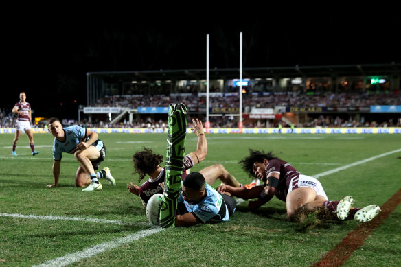 Ronaldo Mulitalo is tackled just short of the line.