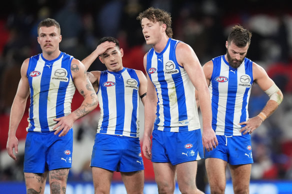 North Melbourne players (from left) Cam Zurhaar, Zac Fisher, Nick Larkey and Luke McDonald after their side coughed up a massive lead to be overrun by Collingwood.