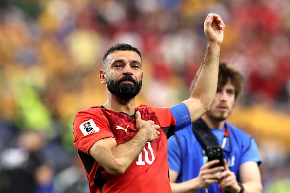 Mo Salah soaks in the emotional moment.