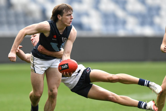 Ollie Hollands, pictured tackling George Wardlaw, is in Carlton’s sights.