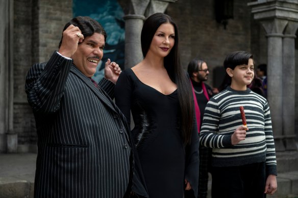 Luis Guzman as Gomez Addams, Catherine Zeta-Jones as Morticia Addams and Issac Ordonez as Pugsley Addams.