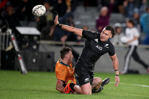 David Havili throws the ball away after beating Tom Banks to score after the siren on Saturday.