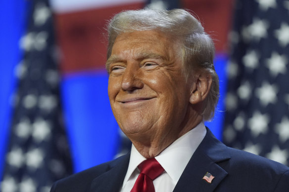Donald Trump smiles at an election night watch party at the Palm Beach Convention Centre.