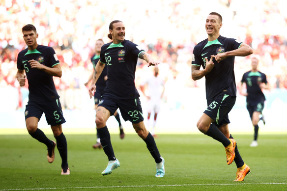 The Socceroos’ Mitch Duke (right) celebrates his winning goal against Tunisia on Saturday night, which also proved a rating winner for SBS.