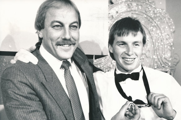 Paul Couch proudly displays the 1989 Brownlow Medal, with some help from his Cats coach Malcolm Blight.