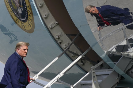 President Donald Trump boards Air Force One at Palm Beach International Airport on December 31, amid rising tensions between the US and Iran.