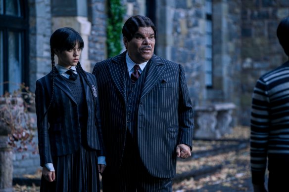 Jenna Ortega as Wednesday Addams and Luis Guzmán as Gomez Addams in Wednesday.