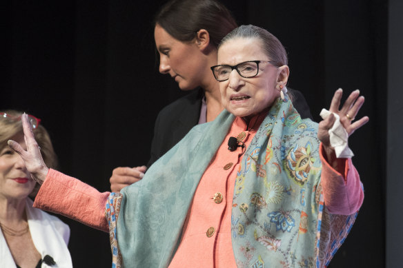 Supreme Court Associate Justice Ruth Bader Ginsburg waves to the audience  in Washington.