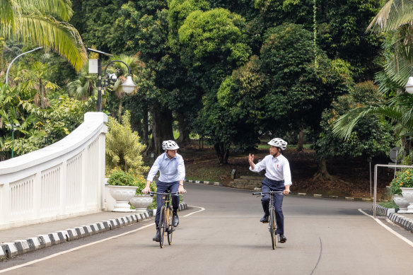 Prime Minister Anthony Albanese and Indonesian President Joko Widodo ride through the gardens of the presidential palace in Bogor.