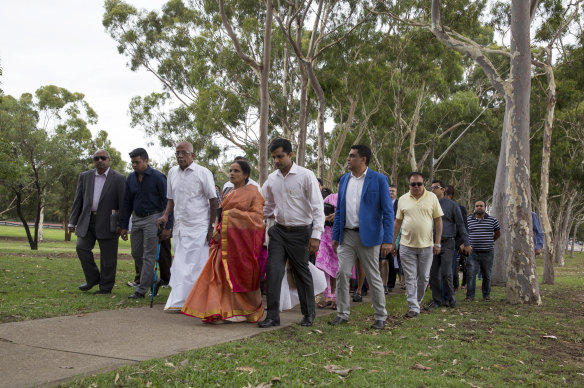 Members of Prabha Kumar's family attend a memorial service for her in 2015.