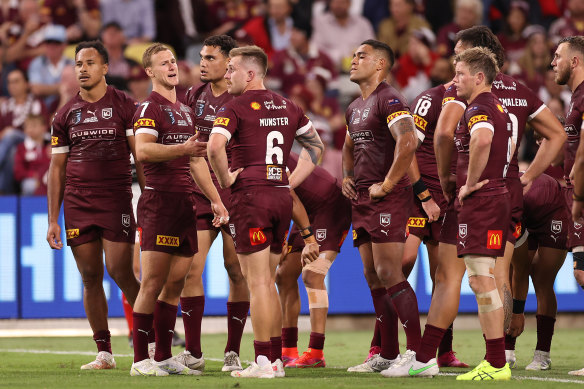 Exhausted Maroons players look on after a Blues try during game one of the 2021 State of Origin.
