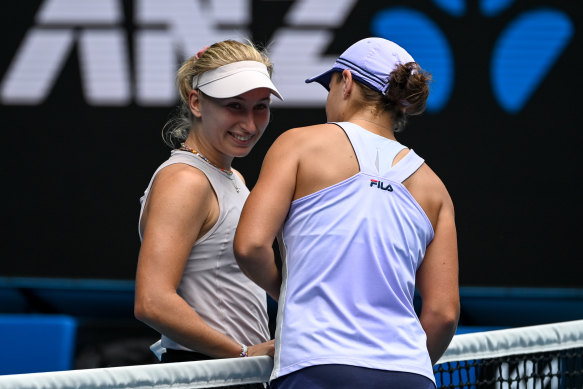 Barty and Gavrilova share a moment at the net.