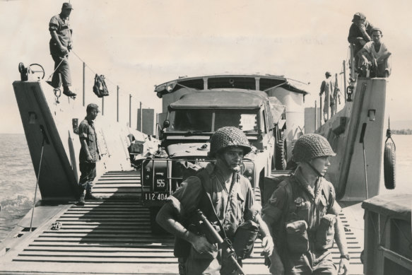 Australian troops and vehicles disembark in Vietnam.