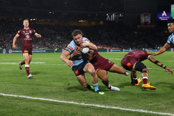 Jack Wighton scores a try for the Blues in last year’s series.