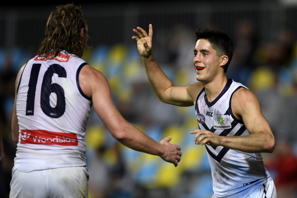 Adam Cerra celebrates a goal for Fremantle.