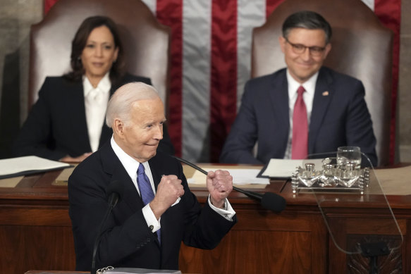 President Joe Biden gestures to Republicans as Vice President Kamala Harris and House Speaker Mike Johnson  watch during the State of the Union address.
