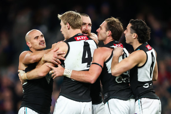 Port Adelaide celebrate a goal.