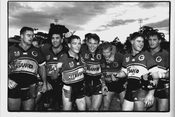 Billy Moore (far left) celebrates a victory with Bears teammates in 1994.