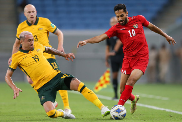 Jordan’s goalscorer Musa Al-Taamari is challenged by Jason Davidson.