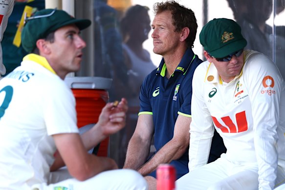 Pat Cummins, selection chair George Bailey and Steve Smith during a difficult day for Australia.